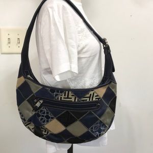 Tiganello, with accents of silver, tan, black‎ patchwork. Like new. Hobo style.